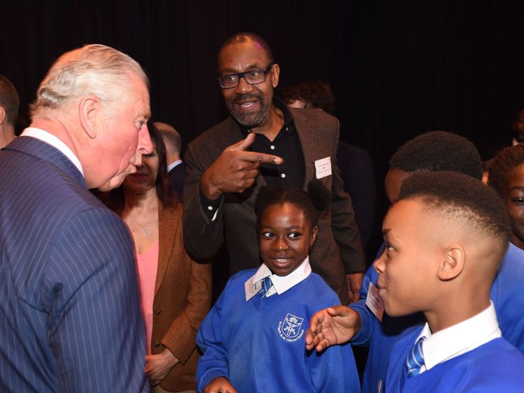 Britain&#39;s Prince Charles, Prince of Wales (L) meets British actor Lenny Henry (C) and school children as he attends an event to promote the arts in schools at the Royal Albert Hall in London on September 5, 2018