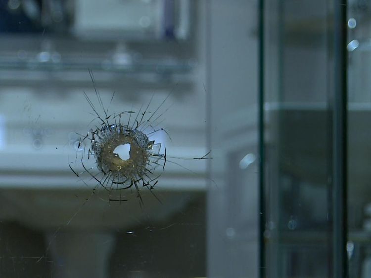 A bathroom window suffered apparent bullet damage