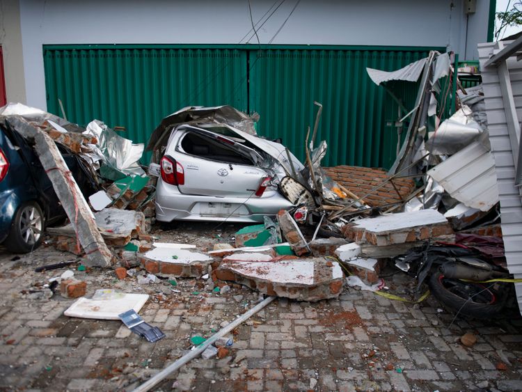 A damaged car following the tsunami and earthquake in Palu