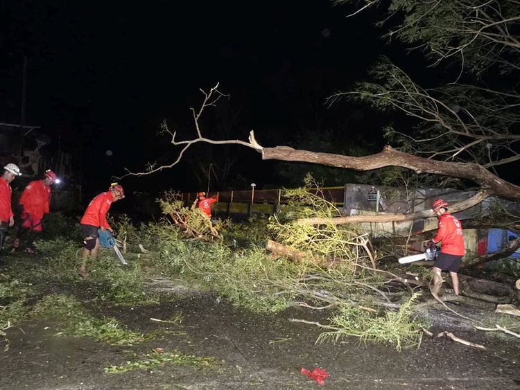 Philippines Red Cross teams have been clearing debris from the road 