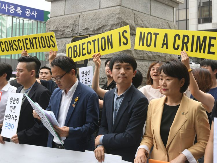 South Korean activists and conscientious objectors to military service during a rally outside the Constitutional Court in Seoul