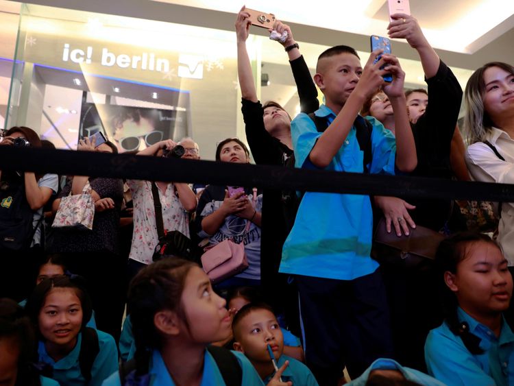 Crowds as the "Wild Boars" soccer team visit an exhibition featuring their cave rescue earlier this year, in Bangkok, Thailand