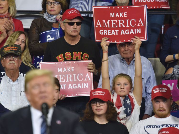 A young supporter of US President Donald Trump holds up a sign as he speaks during a &#39;Make America Great Again&#39; rally in Billings, Montana on September 6, 2018