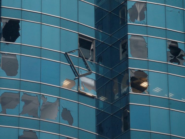 An office tower&#39;s windows are damaged following Typhoon Mangkhut in Hong Kong