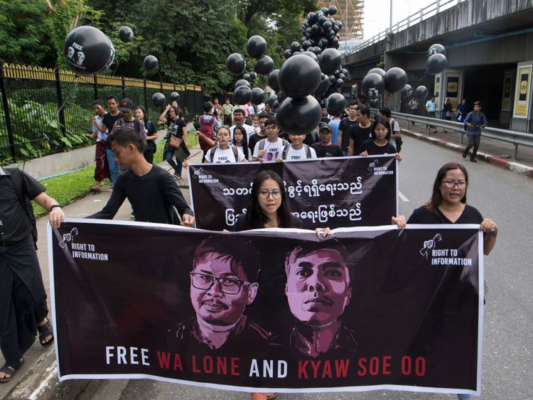 Supporters of detained Myanmar journalists Wa Lone and Kyaw Soe Oo march during a rally demanding for their release