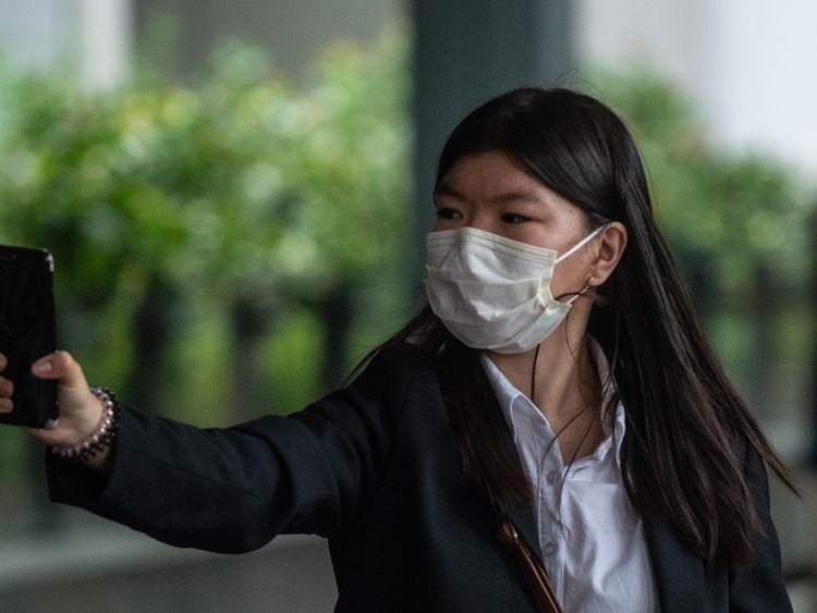 Khaw May-ling, the eldest daughter of the accused, leaves court after testifying