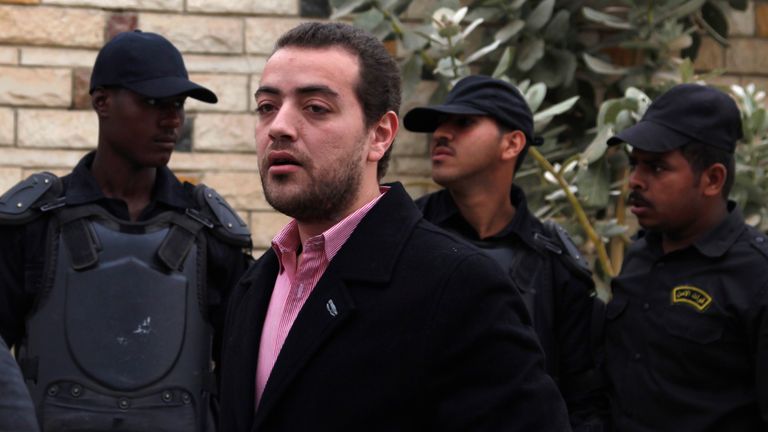 Al Jazeera journalist Baher Mohamed stands outside a court in Egypt in 2015