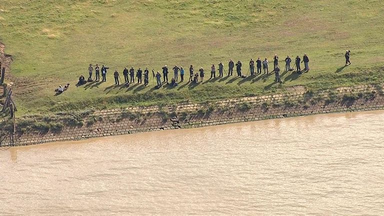 Photographers on the banks of the Thames