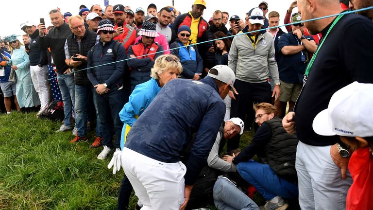 US golfer Brooks Koepka with an injured spectator