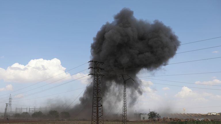 Smoke billows from Syian government bombing around the village of al-Muntar