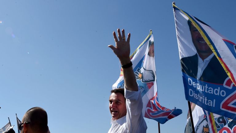 Brazilian right-wing presidential candidate Jair Bolsonaro waves at the crowd during a campaign rally 