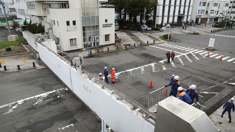 Nagoya port officers close the breakwater gates in Nagoya as Typhoon Jebi hit western Japan