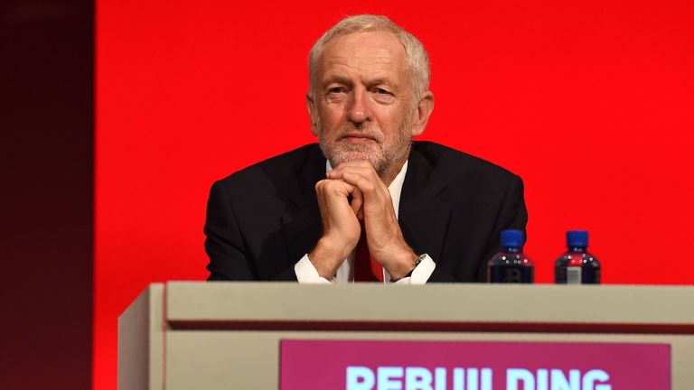 Labour leader Jeremy Corbyn listens to a speech at the party conference in Liverpool