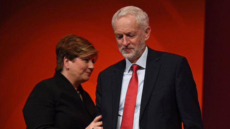 Shadow Foreign Secretary Emily Thornberry (L), touches the arm ofJeremy Corbyn, as she returns to her seat after speaking to delegates at the Labour party conference