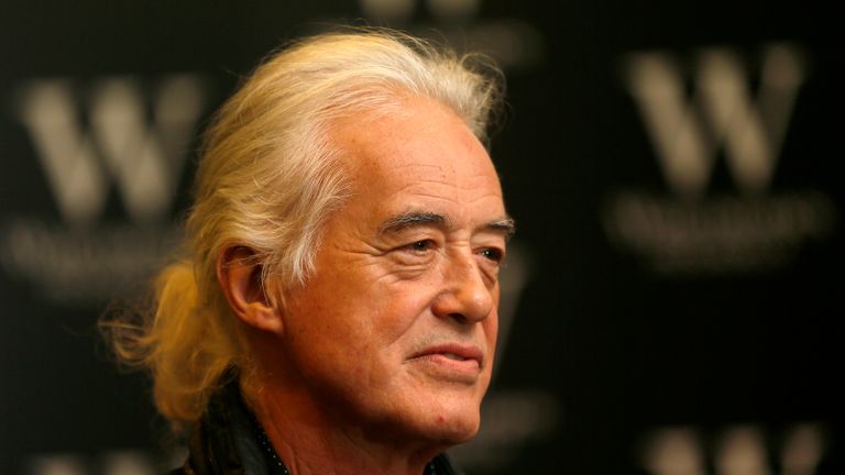 Guitarist Jimmy Page of rock band Led Zeppelin poses for photographers during a book signing for his book at Waterstones in London December 2, 2014