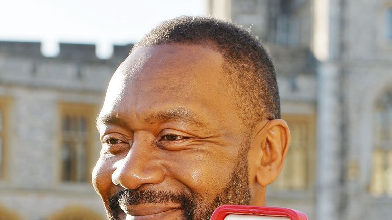 British actor Lenny Henry with his Knighthood after he was presented with it by Britain's Queen Elizabeth during an Investiture ceremony at Windsor Castle in Windsor, west of London on December 4, 2015