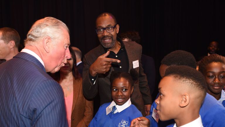 Britain's Prince Charles, Prince of Wales (L) meets British actor Lenny Henry (C) and school children as he attends an event to promote the arts in schools at the Royal Albert Hall in London on September 5, 2018