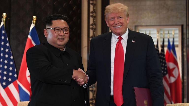 North Korean leader Kim Jong-Un shakes hands with US President Donald Trump during a historic summit of the two nations.