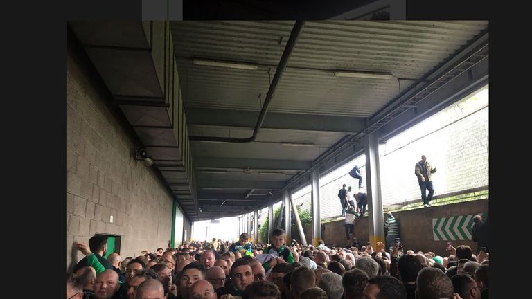 The scene outside the Old Firm derby, with people forced to climb over walls. Pic: @Hoidy
