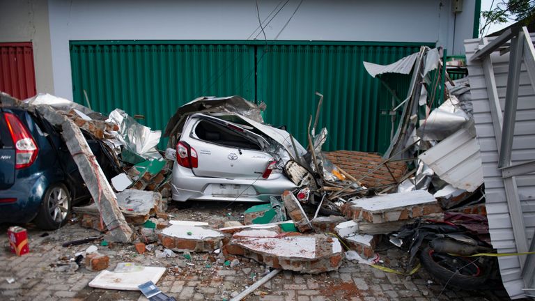 A damaged car following the tsunami and earthquake in Palu