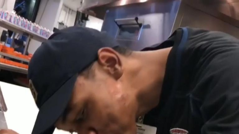 A food service worker at Comerica Park in Detroit was fired after a video was posted online showing him spitting on a pizza.