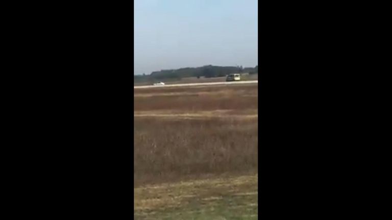 Car pursued by police on runway