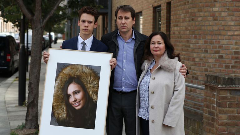 Natasha&#39;s family held a picture of her as they spoke to the media