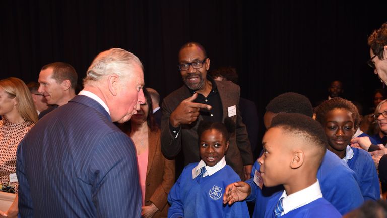Prince Charles meets schoolchildren with Sir Lenny Henry at the Royal Albert Hall in London