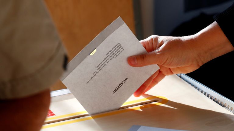 A ballot is dropped into the box at a polling station in Stockholm