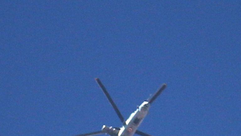 A Syrian army helicopter drops barrel bombs on a rebel-held area in the southern city of Daraa