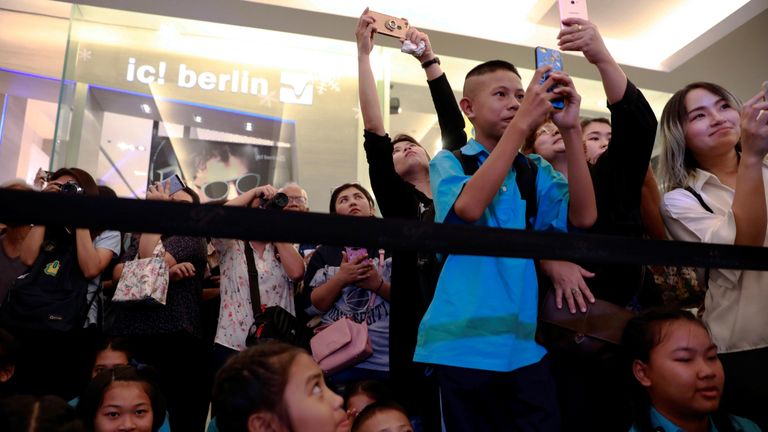 Crowds as the "Wild Boars" soccer team visit an exhibition featuring their cave rescue earlier this year, in Bangkok, Thailand