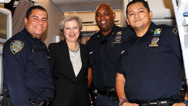 Mrs May posed for a photo with the officers