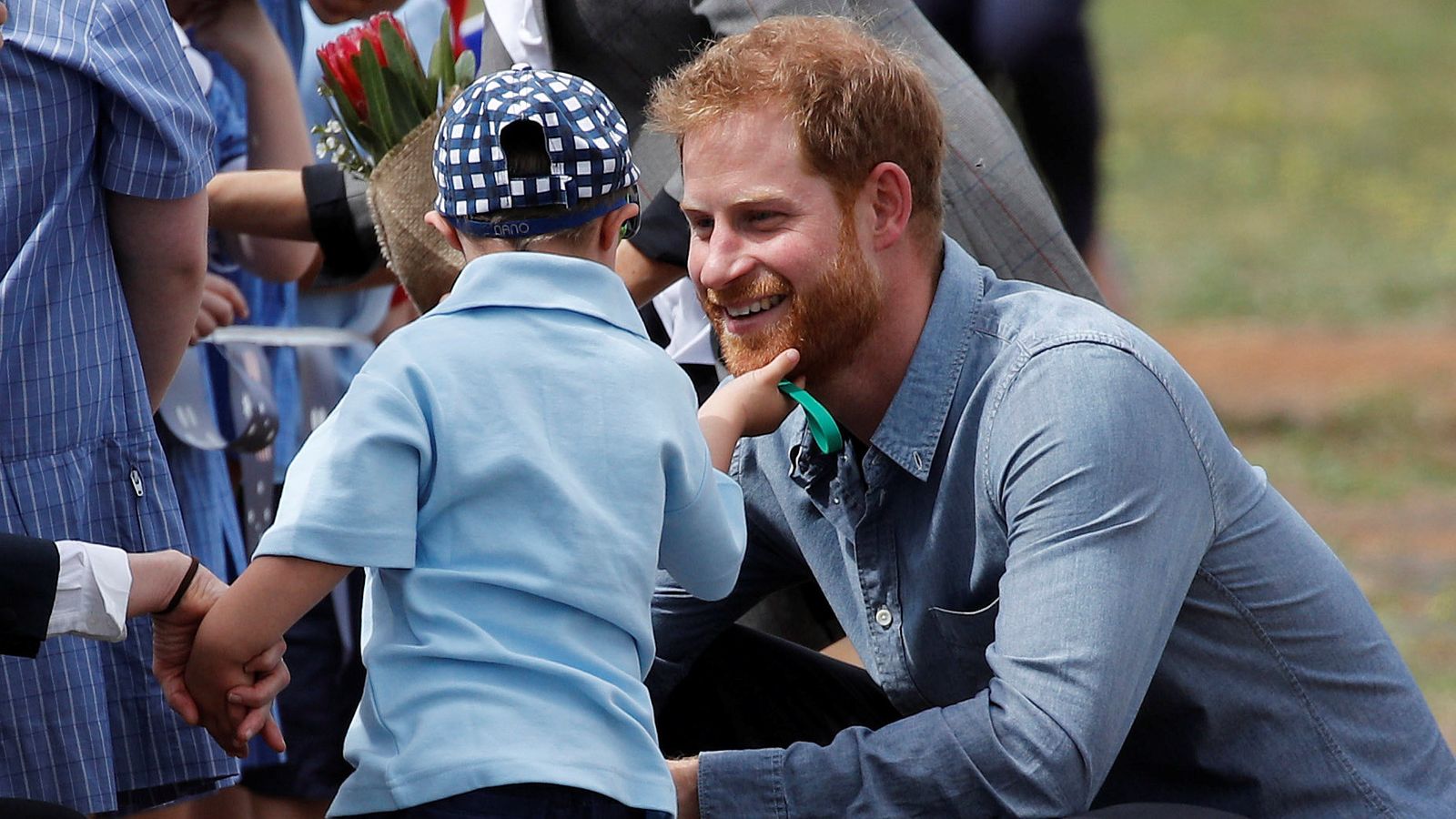 Young boy rubs Prince Harry's beard | World News | Sky News