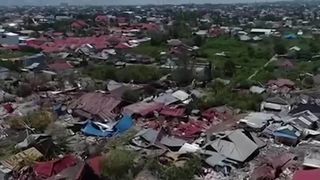 low flying drone shot showing destruction in the Petobo area of Palu city, which suffered heavy damage from last week&#39;s natural disaster