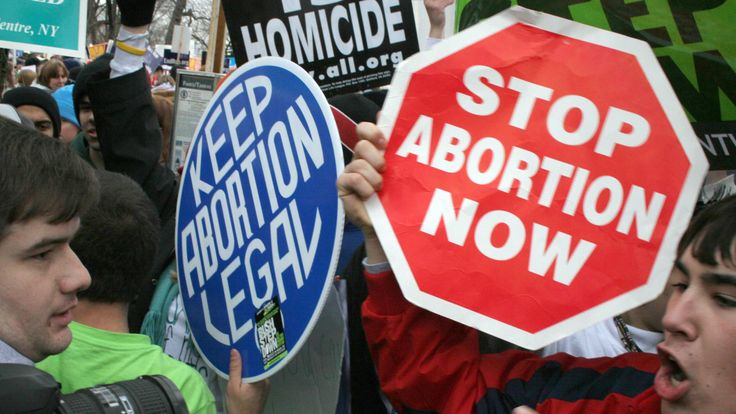 Pro-life and pro-choice protesters clash