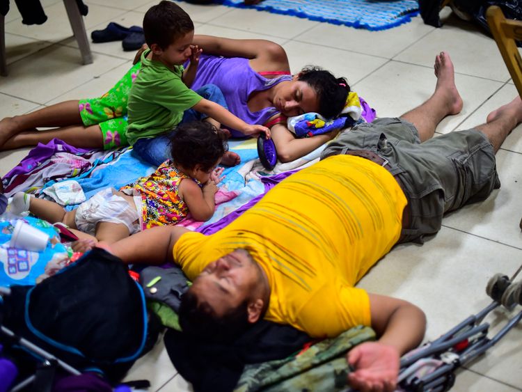 A family spends the night at a temporary shelter in Ciudad Hidalgo, Chiapas state, Mexico