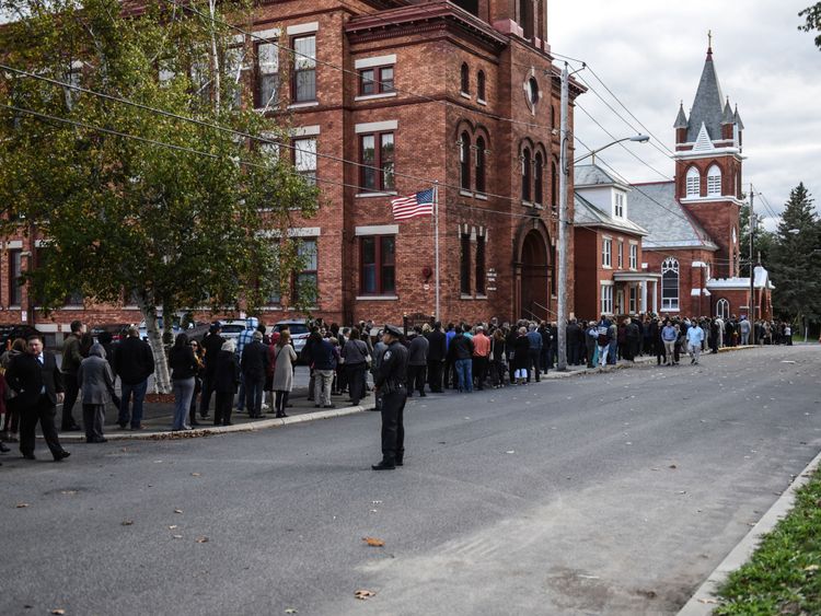Mourners line up in front of St. Stanislaus Roman Catholic Church to pay their respects to some of the victims in last weekend's fatal limo crash on October 12, 2018 in Amsterdam, New York