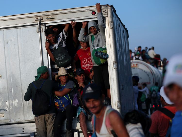Many of the migrants are travelling squished into lorries or on top of them