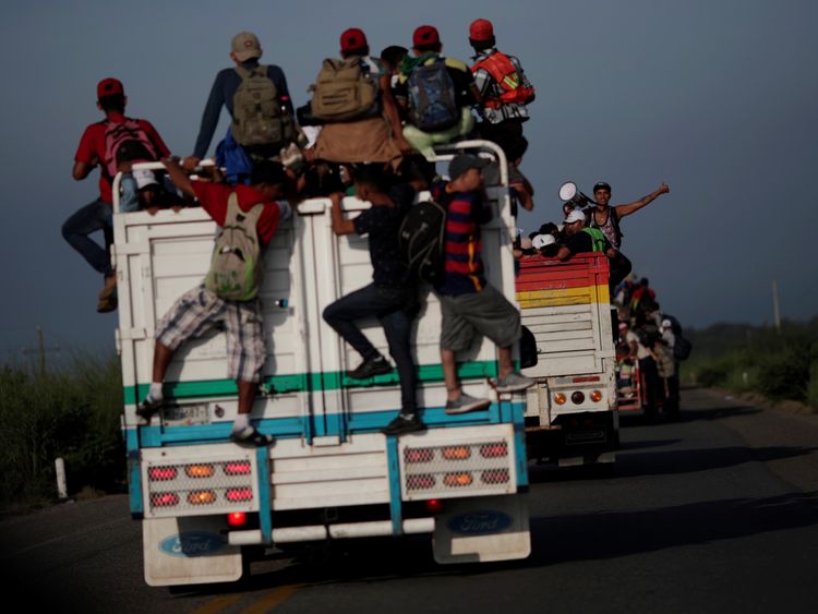 Migrants hitchhike on a truck from San Pedro Tapanatepec in Oaxaca, southern Mexico