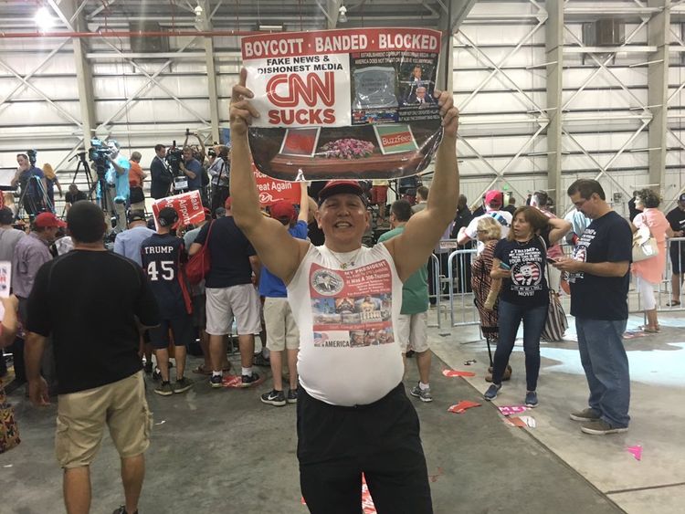 Here Sayoc holds up a sign saying CNN sucks. One of the pipe bombs was sent to CNN. Pic: Cesar Sayoc