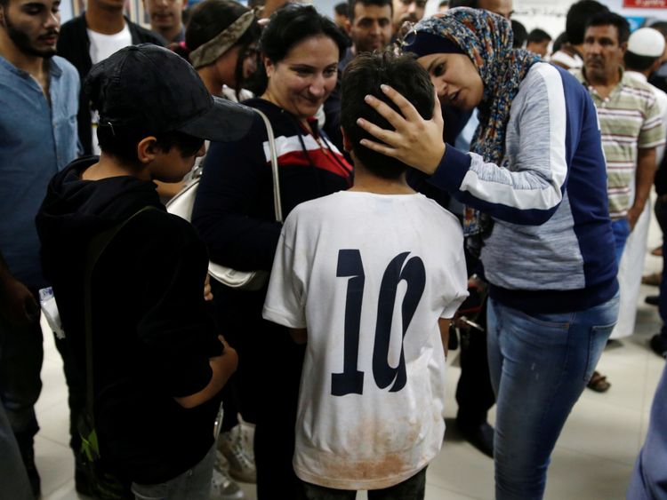 A child survivor is seen with relatives in a hospital near the Dead Sea, Jordan October 25, 2018