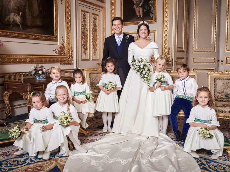 The couple posed with the bridesmaids and pageboys