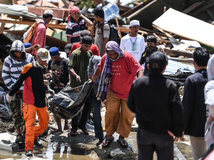 The task of recovering bodies from the wreckage goes on