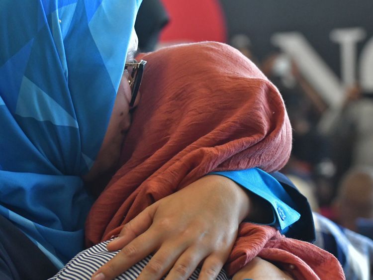 Relatives with family members on board crashed Lion Air flight JT 610 hug as they await information on their loved ones in Pangkal Pinang airport, in Bangka Belitung province on October 29, 2018. - A brand new Indonesian Lion Air plane carrying 189 passengers and crew crashed into the sea on October 29, officials said, moments after it had asked to be allowed to return to Jakarta. (Photo by RONI BAYU / AFP) (Photo credit should read RONI BAYU/AFP/Getty Images)