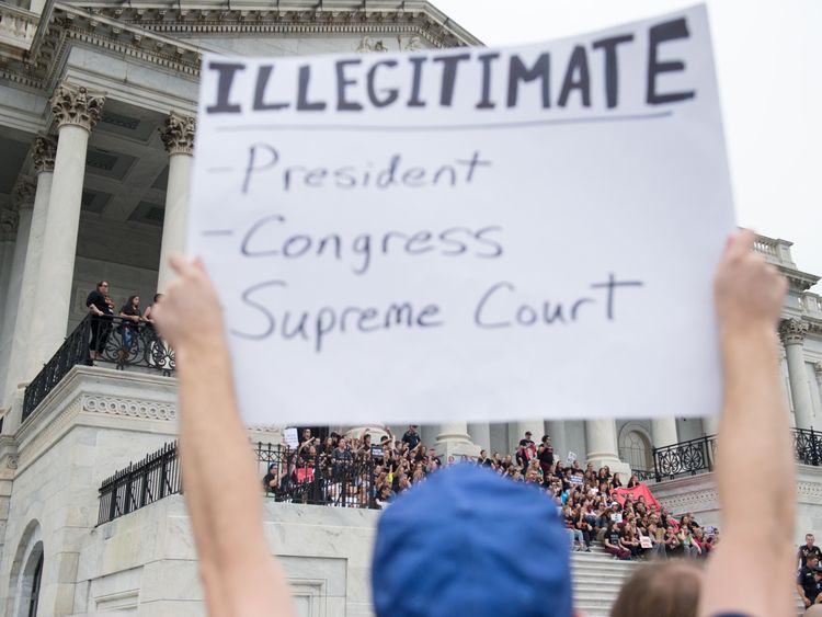 Protestors outside the Supreme Court ahead of Justice Kavanaugh's official swearing-in