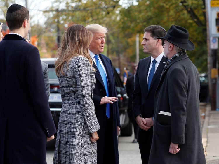 U.S. President Donald Trump talks with Israeli Ambassador to the U.S. Ron Dermer and Tree of Life Synagogue Rabbi Jeffrey Myers as he arrives with (L-R) his daughter Ivanka Trump, son-in-law Jared Kushner and first lady Melania Trump outside the synagogue where a gunman killed eleven people
