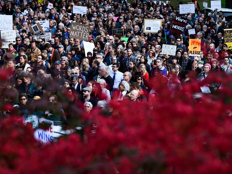 People protesting against US President Donald Trump gather near the Tree of Life Congregation on October 30, 2018 in Pittsburgh, Pennsylvania