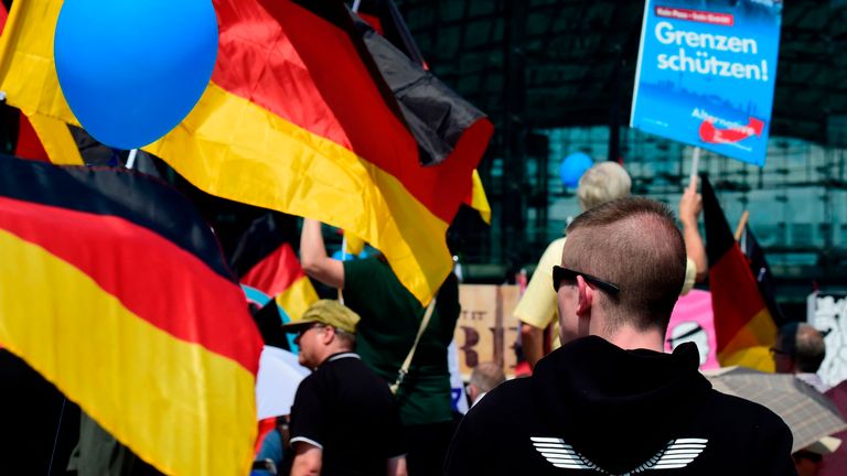 Alternative for Germany (AfD)&#39;s demonstrators holding AfD and German flags gather at the main station in Berlin to attend the &#39;demonstration for the future of Germany&#39; called by the far-right AfD in Berlin on May 27, 2018