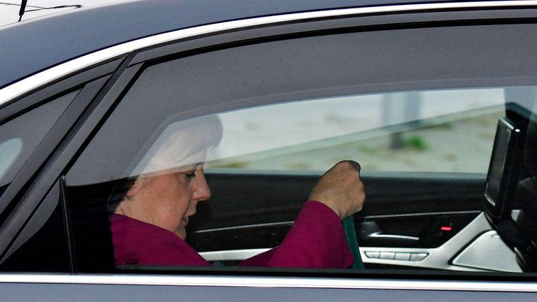 German Chancellor Angela Merkel arrives in her car to attend a leadership meeting of the CDU