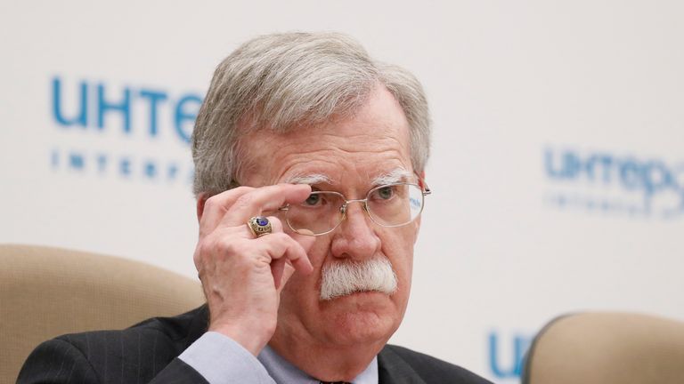 U.S. National Security Adviser John Bolton adjusts glasses during a news conference in Moscow, Russia October 23, 2018.